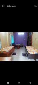 Ένα ή περισσότερα κρεβάτια σε δωμάτιο στο PARK VIEW In MYSORE CITY