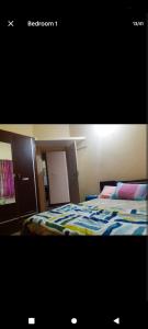 Ένα ή περισσότερα κρεβάτια σε δωμάτιο στο PARK VIEW In MYSORE CITY