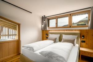 Cama ou camas em um quarto em SUMMERER - Living Nature - Apartments with private SPA