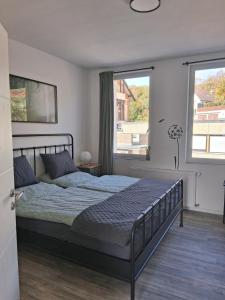 Ένα ή περισσότερα κρεβάτια σε δωμάτιο στο Ferienhaus Wasserkunst am Butterberg - Bohlenmoor