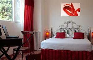 Postel nebo postele na pokoji v ubytování Le Panoramic Boutique Hôtel