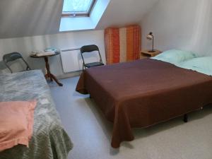 Ένα ή περισσότερα κρεβάτια σε δωμάτιο στο Gîte Thevenin