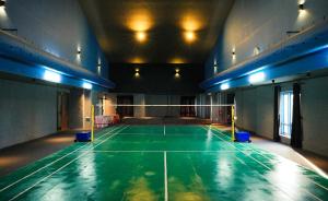 an empty court in a gym with a tennis court at D Fort Hotel Kollam in Kollam +68 photos