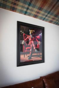 a picture of a teddy bear sitting in a chair at Balmoral Lodge, King Size Apartment by The Hive WA1 in Warrington +9 photos
