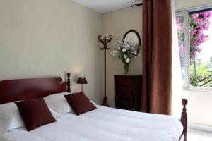Postel nebo postele na pokoji v ubytování Le Panoramic Boutique Hôtel