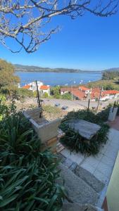 a set of stairs with a view of the water at CASA da LINHA in Deveza