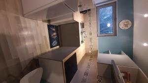 a bathroom with a sink and a toilet in a room at 2-bed apartment in Limoges