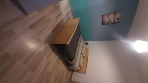 a bedroom with a bed in a box at 2-bed apartment in Limoges