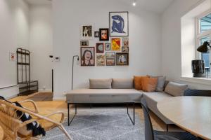 a living room with a couch and a table at Northstay - Town Square in Tromsø