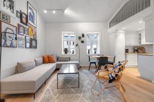a living room with a couch and a table at Northstay - Town Square in Tromsø