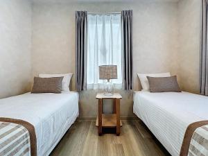Ένα ή περισσότερα κρεβάτια σε δωμάτιο στο Viento Ikebukuro