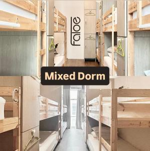 a room with bunk beds with the text musicoked donut at Faloe Hostel in Kota Kinabalu