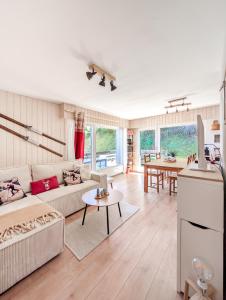 a living room with a couch and a table at Cosy Centered with Garden and View in Veysonnaz in Veysonnaz +30 photos