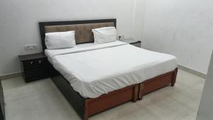 Ένα ή περισσότερα κρεβάτια σε δωμάτιο στο SKY Inn by Twamev