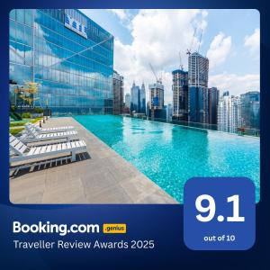 a swimming pool with a city skyline in the background at Dorsett Residences Bukit Bintang in Kuala Lumpur
