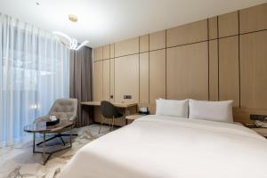Postel nebo postele na pokoji v ubytování Hotel Mayotte + 19 fotografií