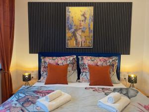a bedroom with a bed with two towels on it at Residence S5 - Comfort Living Apartment in Prešov
