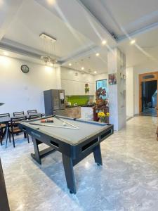 a large room with a pool table in it at AnAn VILLA in Khu Chi Lăng