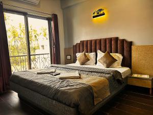 Postel nebo postele na pokoji v ubytování Ragvi Resort Alibaug