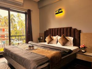Postel nebo postele na pokoji v ubytování Ragvi Resort Alibaug