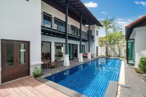 an image of a villa with a swimming pool at Blue Village Villa - Heritage style pool villa 2 storey and 3 bedrooms in Thalang