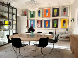 a dining room with a table and chairs at Luxury 260 sqm with 4BR overlooking Kings Garden in Copenhagen