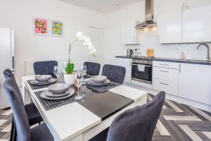 a kitchen with a dining room table and chairs at St Pauls Terrace in Ryhope