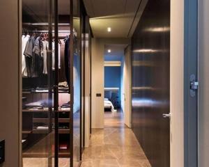 a hallway with a walk in closet and a room at Karl Penthouse in Rostock