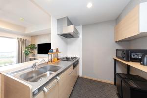 Kuchyň nebo kuchyňský kout v ubytování レジデンスホテル博多駅南