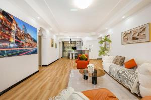 a living room with a couch and a table at Deptour Riverview aparment-ChaoTianMen in Chongqing +73 photos