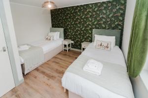 Ένα ή περισσότερα κρεβάτια σε δωμάτιο στο Harrapool Hideout Skye