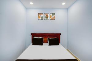 Ένα ή περισσότερα κρεβάτια σε δωμάτιο στο Hotel O Stayo +21 φωτογραφίες