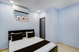 Ένα ή περισσότερα κρεβάτια σε δωμάτιο στο Hotel O Stayo