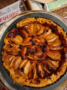 a pie in a pan on a table at La Ferme de la Soula in Lombrès