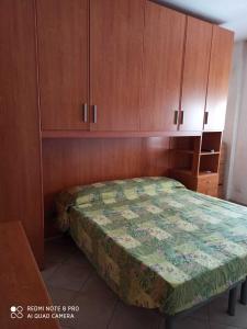 Ένα ή περισσότερα κρεβάτια σε δωμάτιο στο Casa Tuveri