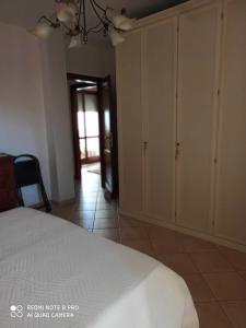 Ένα ή περισσότερα κρεβάτια σε δωμάτιο στο Casa Tuveri +2 φωτογραφίες
