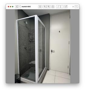 a shower with a glass door in a bathroom at 22 Monks View in Plettenberg Bay