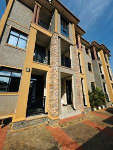 a large building with windows and balconies on it at True's cozy homes in Kira +14 photos