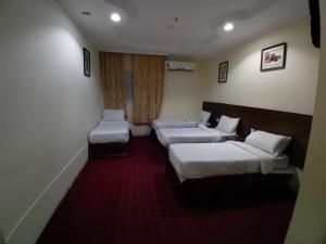 Postel nebo postele na pokoji v ubytování JOHRA MESSAT Hotel
