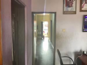 a hallway with a door leading to a room at Otam homes in Akure