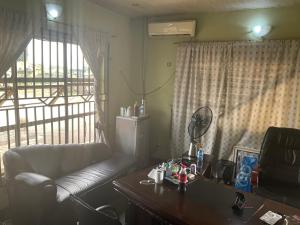 a living room with a couch and a table at Otam homes in Akure