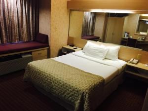 Postel nebo postele na pokoji v ubytování Microtel Inn & Suites by Wyndham Syracuse Baldwinsville