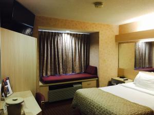 Postel nebo postele na pokoji v ubytování Microtel Inn & Suites by Wyndham Syracuse Baldwinsville