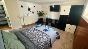 a bedroom with a bed and a tv in it at Casa a 4 zampe in Gorizia