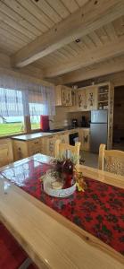 a kitchen with a table with a christmas decoration on it at Bachledowy Wierch 2 in Czerwienne