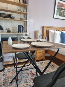 a table with two glasses on top of it at Sandy Paws in Portreath +12 photos