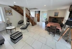 a large living room with a table and chairs at Maison des Cimes, Garden, cozy for 8 people in Ayzac-Ost