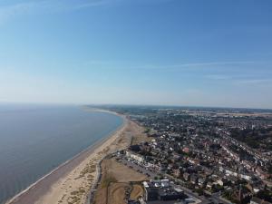 an aerial view of a beach and the ocean at Dog Friendly 6 Berth Caravan With Decking Close To Pakefield Beach Ref 68106Cr in Pakefield