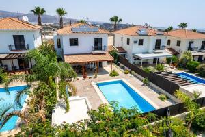 an aerial view of a villa with a swimming pool at 4 Bedroom Villa With Private Pool in Maroni