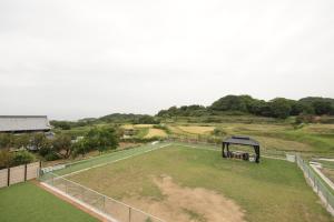 an aerial view of a field with a gazebo at Awaji Nature Retreat in Awaji
